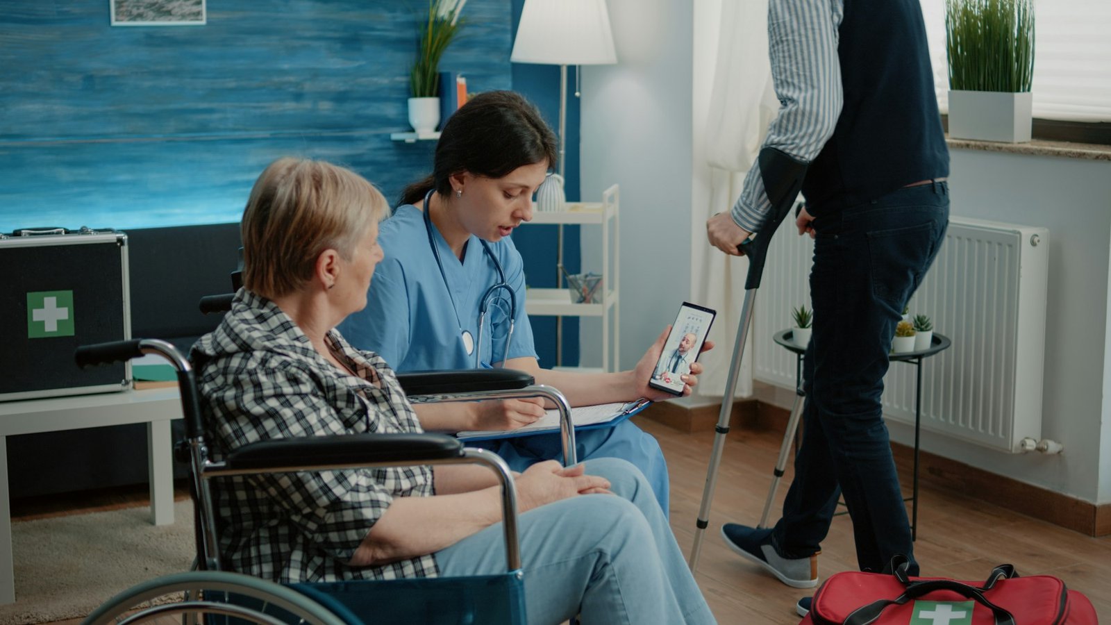 Retired woman and nurse talking to doctor on video call